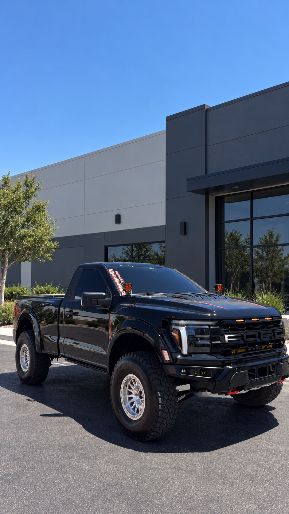 Black Ford F-150 Raptor R with tinted windows